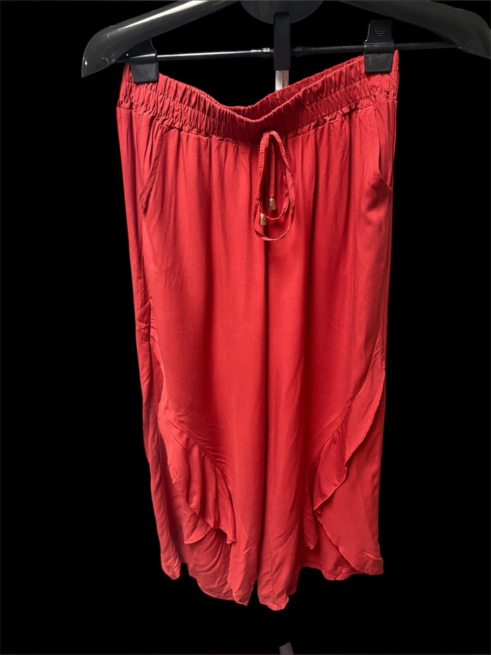 Women’s Red Midi Drawstring Pant with Ruffle Detail at bottom of leg. Size M.